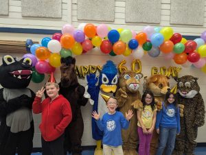 Students and other schools' mascots celebrate with Jay Jay and the other elementary school mascots at the school birthday party.